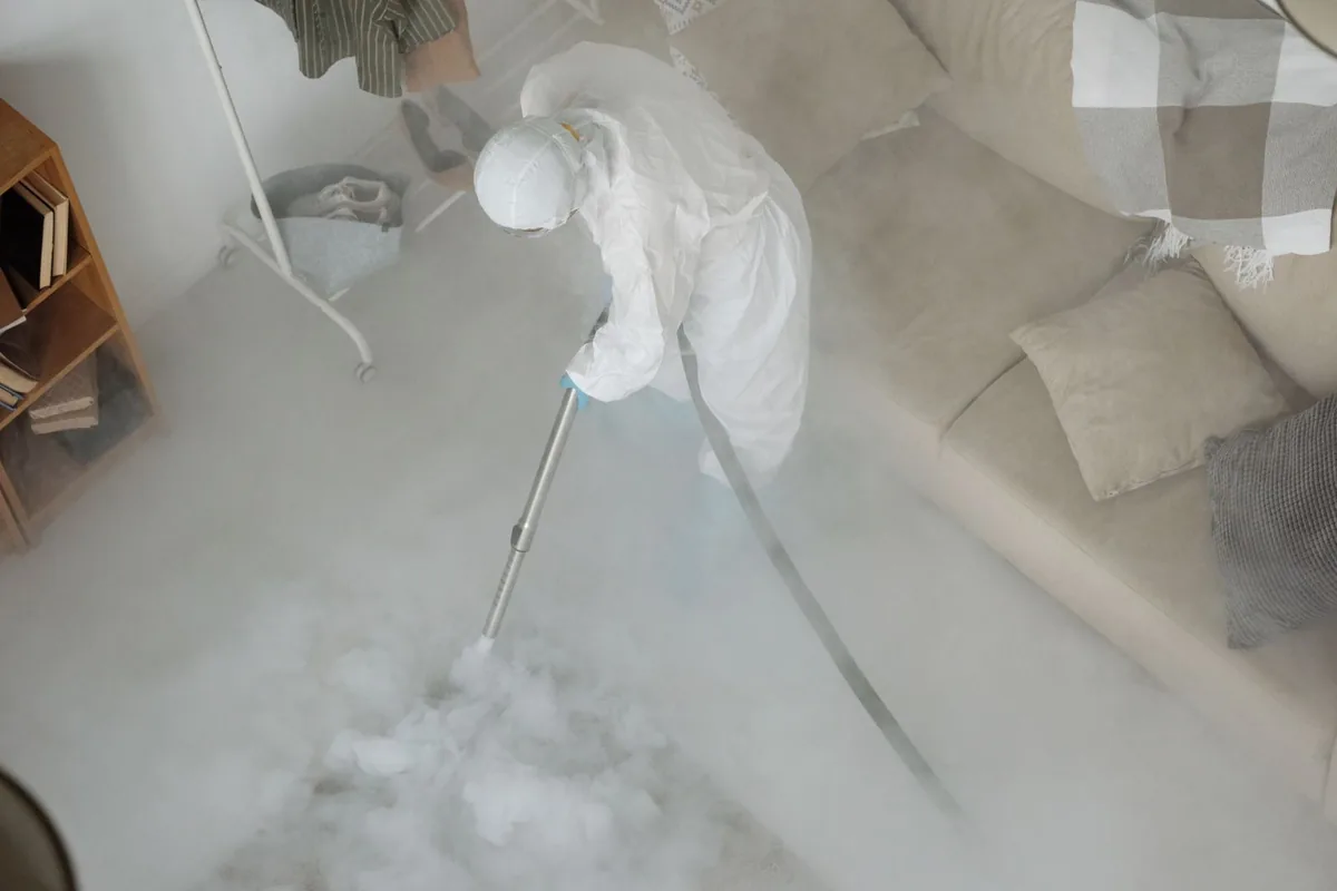 Biohazard cleanup technician in protective equipment, Dearborn Heights, MI